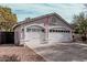 Charming one-story home featuring a two car garage, desert landscaping, and neutral colored stucco at 1431 S Nielson St, Gilbert, AZ 85296