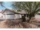 Charming one-story home featuring a two car garage, desert landscaping, and neutral colored stucco at 1431 S Nielson St, Gilbert, AZ 85296