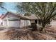 Charming one-story home featuring a two car garage, desert landscaping, and neutral colored stucco at 1431 S Nielson St, Gilbert, AZ 85296