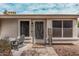 Inviting front porch area with seating, desert landscaping, and a welcoming sign at 1431 S Nielson St, Gilbert, AZ 85296