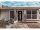 Inviting front porch area with seating, desert landscaping, and a welcoming sign at 1431 S Nielson St, Gilbert, AZ 85296