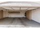 Well-organized garage featuring built-in storage cabinets and epoxy floors at 1431 S Nielson St, Gilbert, AZ 85296