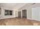 Living room featuring wood tile flooring, front door, and closet at 1431 S Nielson St, Gilbert, AZ 85296