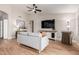 Comfortable living room featuring a gray sofa and TV at 1431 S Nielson St, Gilbert, AZ 85296