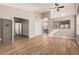 Open living room featuring wood tile flooring and multiple entrances at 1431 S Nielson St, Gilbert, AZ 85296