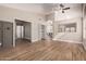 Open living room featuring wood tile flooring and multiple entrances at 1431 S Nielson St, Gilbert, AZ 85296