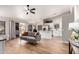 Open living space with gray sofa and view to the modern kitchen at 1431 S Nielson St, Gilbert, AZ 85296