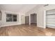 Living room featuring wood tile flooring, front door, and closet at 1431 S Nielson St, Gilbert, AZ 85296