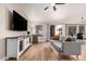 Living room with gray sofa and sliding glass doors to backyard at 1431 S Nielson St, Gilbert, AZ 85296