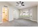 This beautiful main bedroom features a bay window and a ceiling fan at 1431 S Nielson St, Gilbert, AZ 85296