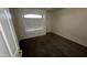 Bedroom featuring plush carpeting and a window with blinds at 14334 W Avalon Dr, Goodyear, AZ 85395