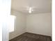 Cozy bedroom with a ceiling fan and window at 14334 W Avalon Dr, Goodyear, AZ 85395
