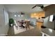 An open concept dining room features a decorative table, a faux fur rug, and lots of natural light at 14334 W Avalon Dr, Goodyear, AZ 85395