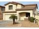 Charming two-story home features a two-car garage, low maintenance yard, and neutral color palette at 14334 W Avalon Dr, Goodyear, AZ 85395