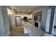 Bright kitchen featuring white cabinets, stainless steel appliances, and a marble island at 14334 W Avalon Dr, Goodyear, AZ 85395