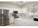 Bright kitchen boasts quartz countertops, stainless appliances, and ample cabinet space at 14334 W Avalon Dr, Goodyear, AZ 85395