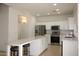 Modern kitchen features stainless steel appliances and a stylish quartz island at 14334 W Avalon Dr, Goodyear, AZ 85395