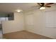 Spacious room featuring tile flooring, a ceiling fan, and lots of natural light at 14334 W Avalon Dr, Goodyear, AZ 85395