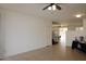 Open living room featuring neutral tile floors and an open floor plan at 14334 W Avalon Dr, Goodyear, AZ 85395