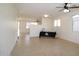Spacious living room boasts neutral tile floors and an open floor plan at 14334 W Avalon Dr, Goodyear, AZ 85395