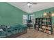 Bright bedroom with modern decor, a desk, and a custom bookcase at 15011 N 45Th Pl, Phoenix, AZ 85032