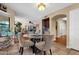 Cozy dining area with a glass-topped table, seating for four, and bright natural light at 15011 N 45Th Pl, Phoenix, AZ 85032