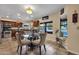 Sunny eat-in kitchen with tile floors, a glass table, and large windows showcasing the pool area at 15011 N 45Th Pl, Phoenix, AZ 85032