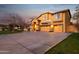 Spacious home featuring a long driveway and a three-car garage with a basketball hoop at 15011 N 45Th Pl, Phoenix, AZ 85032