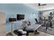 This home gym space features ample equipment and plenty of room for working out at 15011 N 45Th Pl, Phoenix, AZ 85032