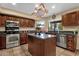 Well-equipped kitchen with stainless steel appliances, a large island, and stylish cabinetry at 15011 N 45Th Pl, Phoenix, AZ 85032