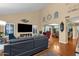 Open-concept living area with hardwood floors and seamless transition into the dining area at 15011 N 45Th Pl, Phoenix, AZ 85032