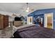 Large main bedroom with mountain-themed wall art, ceiling fan and ensuite bath at 15011 N 45Th Pl, Phoenix, AZ 85032