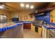 Outdoor kitchen space with tile countertops, BBQ grill and custom tile work at 15011 N 45Th Pl, Phoenix, AZ 85032