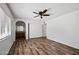 Bedroom with neutral walls, closet, wood-look flooring and ceiling fan with light at 15652 N 52Nd St, Scottsdale, AZ 85254