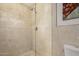 Elegant bathroom with a glass-enclosed shower and tiled walls at 15843 E Mustang Dr, Fountain Hills, AZ 85268