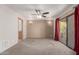 Bright and airy bedroom with neutral walls, carpet, sliding door access, and a ceiling fan at 15843 E Mustang Dr, Fountain Hills, AZ 85268