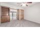 Bedroom featuring a wooden cabinet with open doors revealing a bright living area at 15843 E Mustang Dr, Fountain Hills, AZ 85268