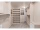 Spacious walk-in closet with custom shelving and drawers, providing ample storage space at 15843 E Mustang Dr, Fountain Hills, AZ 85268
