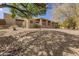 Spacious single-story home featuring desert landscaping and a covered patio, perfect for outdoor living at 15843 E Mustang Dr, Fountain Hills, AZ 85268