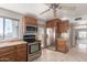 Well-equipped kitchen with stainless steel appliances, wooden cabinets and stone countertops at 15843 E Mustang Dr, Fountain Hills, AZ 85268