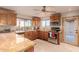 Well-lit kitchen features stone countertops, stainless steel appliances, and generous counter space at 15843 E Mustang Dr, Fountain Hills, AZ 85268