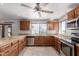 Spacious kitchen featuring wooden cabinetry, granite countertops, and stainless steel appliances at 15843 E Mustang Dr, Fountain Hills, AZ 85268