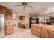 Bright kitchen featuring wooden cabinets, a large island, and stainless steel appliances, perfect for cooking and entertaining at 15843 E Mustang Dr, Fountain Hills, AZ 85268