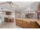 Open kitchen featuring a built-in desk area and granite countertops at 15843 E Mustang Dr, Fountain Hills, AZ 85268