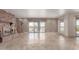 Elegant living room with tile floors, a brick fireplace, sliding glass doors leading to outdoor view at 15843 E Mustang Dr, Fountain Hills, AZ 85268