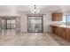 Inviting living room seamlessly connects to an outdoor view with tile floors, and a charming breakfast bar at 15843 E Mustang Dr, Fountain Hills, AZ 85268