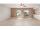Spacious living room features neutral walls, light tile floors, two large windows, and built-in cabinets at 15843 E Mustang Dr, Fountain Hills, AZ 85268