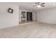 Open-concept living room boasts neutral walls, tile floors, and a ceiling fan for a bright and airy feel at 15843 E Mustang Dr, Fountain Hills, AZ 85268