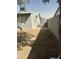 Image of the backyard with a walking path, and a fence at 1630 N 58Th Ave, Phoenix, AZ 85035