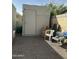 Enclosed backyard featuring a storage shed, gravel flooring, and some outdoor furniture at 1630 N 58Th Ave, Phoenix, AZ 85035